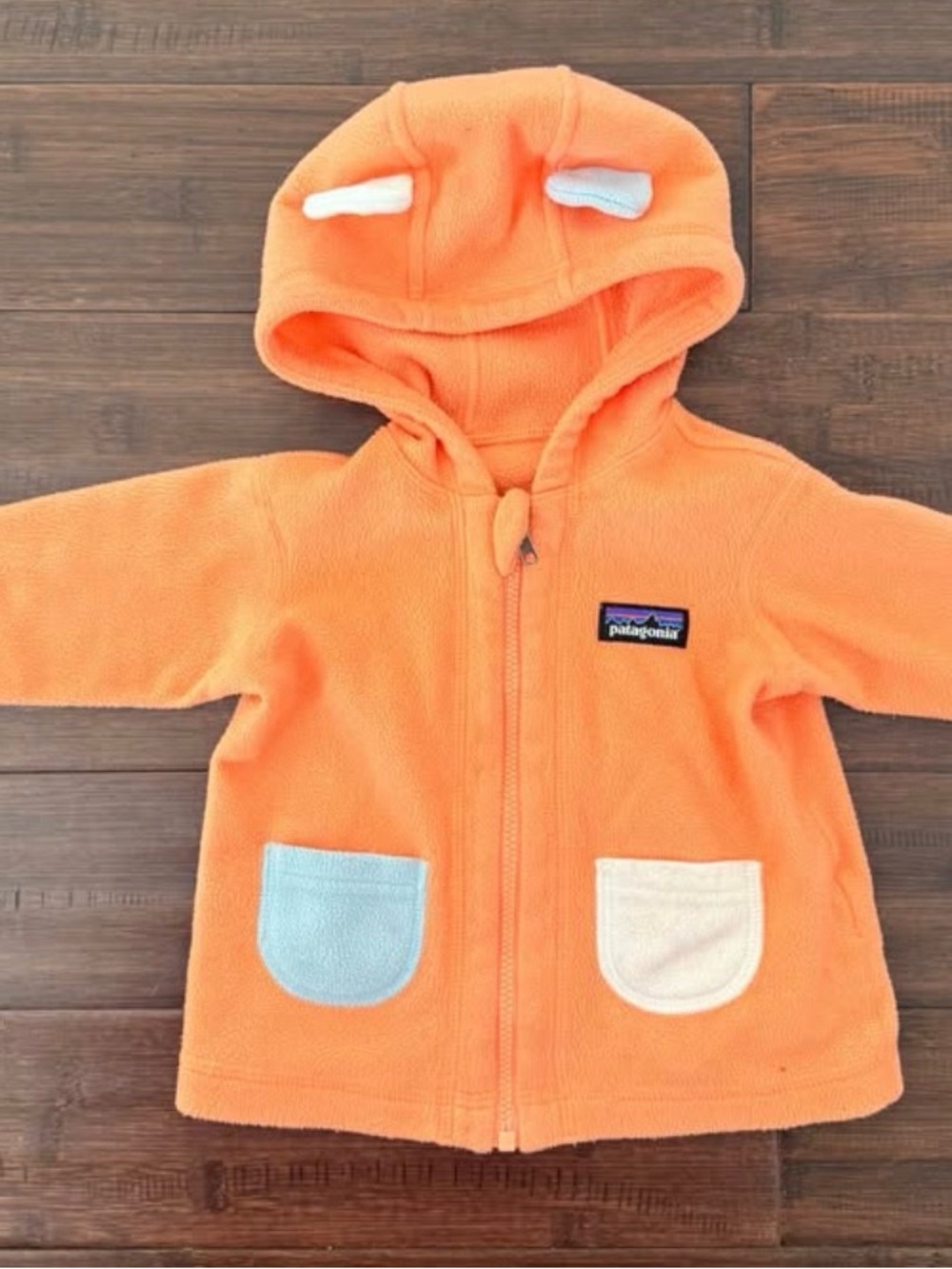 Patagonia Orange Baby Fleece Hoodie with Light Blue and Cream Pockets